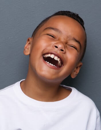 Young boy with wide smile