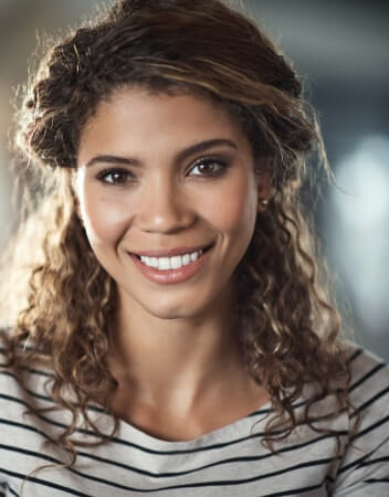 Young woman in striped shirt smiling