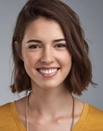 Girl smiling in yellow shirt