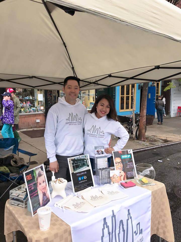 Dr. Nguyen at the Queensboro Plaza Dental Care booth at the Long Island City community block festival in May 2018