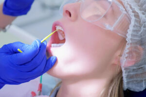 Patient in the dental chair getting a fluoride treatment.