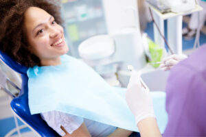 Woman in the dental chair for a dental exam.