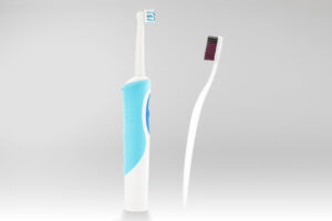 An electric and a manual toothbrush.