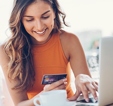 happy woman paying a bill