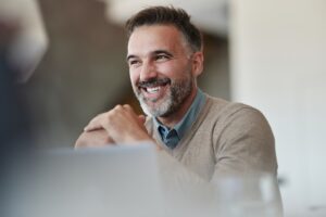 man at work after dental implant recovery
